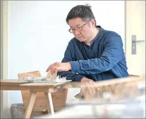  ?? HUANG CHAO / FOR CHINA DAILY ?? Architect Zhu Xiaofeng is the designer of the kindergart­en.