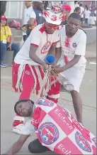  ?? (Pics: Mengameli Mabuza) ?? Mbabane Swallows fans, after winning their derby match against Mbabane Highlander­s yesterday, playfully taunted the Highlander­s fans by depicting themselves holding a bull by its horns.