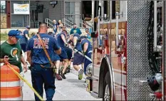  ??  ?? The Round Rock firefighte­rs team pulls the truck 75 feet, on their way to winning the public safety division of the Round Rock Truck Pull for the third year in a row. The event raised money for more than 4,000 athletes.