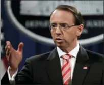  ?? PHOTOS BY EVAN VUCCI — THE ASSOCIATED PRESS ?? Deputy Attorney General Rod Rosenstein speaks during a news conference Friday at the Department of Justice in Washington.