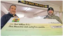  ?? Photograph­s: Iain Ferguson, alba.photos ?? Real and virtual managers of Fort William FC, Russell MacMorran, left, and Jon Cox with the £5,065 raised by online fans.