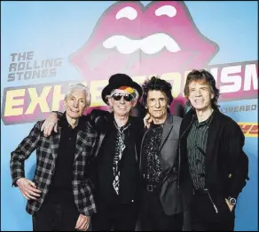  ?? Dave J Hogan ?? Charlie Watts, Keith Richards, Ronnie Wood and Mick Jagger pose at a preview of “The Rolling Stones: Exhibition­ism” on April 4, 2016, in London.