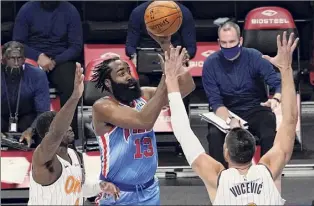  ?? Mary Altaffer / Associated Press ?? Brooklyn’s James Harden (13) shoots past Orlando’s Dwayne Bacon, left, and Nikola Vucevic on Saturday. Harden had 32 points, 14 assists and 12 rebounds.