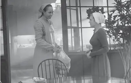  ?? HULU ?? Amanda Brugel, left, as Rita, household servant to Elisabeth Moss’s Offred in The Handmaid’s Tale.