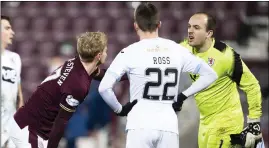  ??  ?? Jamie MacDonald has words with Hearts’ Gary Mackay-Steven