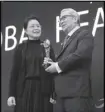  ??  ?? Garilao receives the award from Liang Weina, vice-chair of China Institute of Strategy and Management.