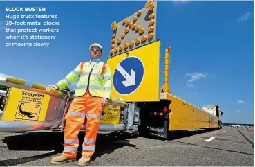  ??  ?? BLOCK BUSTER Huge truck features 20-foot metal blocks that protect workers when it’s stationary or moving slowly
