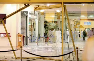 ?? File photos ?? The broken main door at the entrance of Wafi Mall through which the Pink Panther gang entered the mall, and (below) the combo pictures of Wafi Mall heist. —