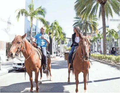  ?? PAUL HEBERT, ABC ?? Anthony Battle and Texas native Rachel Lindsay bring a little rodeo to Rodeo Drive on The Bacheloret­te.