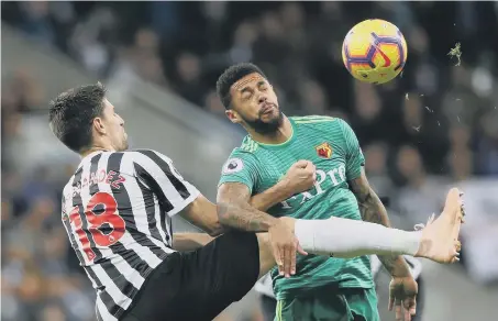  ??  ?? Newcastle United’s Federico Fernandez and Watford’s Andre Gray battle for the ball on Saturday.