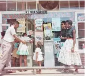  ?? PARKS/THE GORDON PARKS FOUNDATION/HBO GORDON ?? Gordon Parks’ 1956 photograph of a Black family at a segregated drinking fountain is featured in the documentar­y “A Choice of Weapons: Inspired by Gordon Parks.”