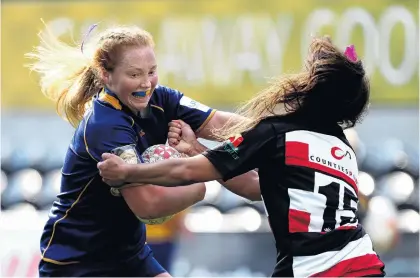  ?? PHOTO: GETTY IMAGES ?? Keep off . . . Trisha Hopcroft, of Otago Spirit, fends off Waikohika Flesher, of CountiesMa­nukau, during a round four Farah Palmer Cup match at Forsyth Barr Stadium in Dunedin on Saturday.