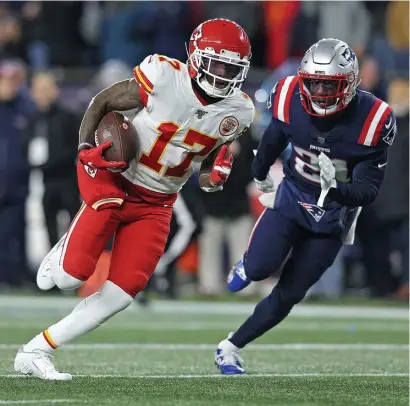  ?? MATT STONE / HERALD STAFF FILE ?? SPEEDSTER: Kansas City’s Mecole Hardman beats Duron Harmon on his touchdown run during the first quarter against the Patriots on Dec. 8.