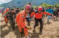  ?? Foto: Veri Sanovri, dpa ?? Die Einsatzkrä­fte in Indonesien waren pausenlos im Einsatz, um die Vulkan Kletterer zu retten.