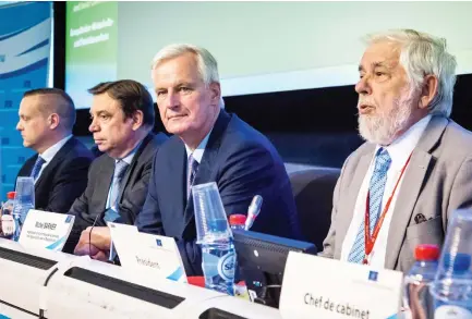  ??  ?? European Commission member in charge of Brexit negotiatio­ns, Michel Barnier, second right, at the start of a European Economic and Social Committee in Brussels on Thursday. (AFP)