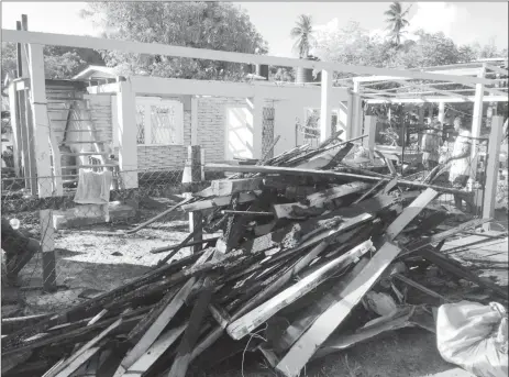  ??  ?? The charred remains of Parbattie Baggie’s two-storey La Jalousie, West Coast Demerara, home.