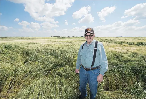  ?? TROY FLEECE ?? Edwin Fuhr, a retired farmer, recalls his a close encounter with five UFOs while swathing in his field in the 1970s. His story made internatio­nal news and is one of the most documented UFO cases in Canadian history. Fuhr stands in a field near where...