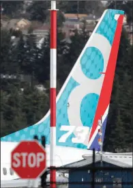  ?? AP/TED S. WARREN ?? A Boeing 737 Max 8 plane sits parked Thursday at King County Internatio­nal Airport, often called Boeing Field, in Seattle. Boeing Co. officials say they support grounding the Max 8 and Max 9 aircraft.