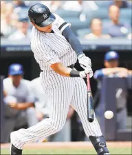  ?? Kathy Willens / Associated Press ?? Gio Urshela of the Yankees hits a tworun single during the second inning of Sunday’s 42 win over the Blue Jays in New York.