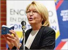  ??  ?? This file photo shows Ortega speaking during the ‘In Defence of Democracy Forum’ held by the opposition in Caracas, a day after a new assembly with supreme powers and loyal to Maduro started functionin­g and fired her. — AFP photo