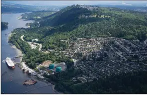  ?? AP/The Canadian Press/JONATHAN HAYWARD ?? A Canada court Thursday halted pipeline expansion plans from the Trans Mountain terminal (above) in Burnaby, British Columbia.