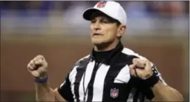  ?? CARLOS OSORIO — THE ASSOCIATED PRESS FILE ?? Referee Ed Hochuli signals during a game between the Lions and Chargers in Detroit. Hochuli will be the man in the middle for the NFC Championsh­ip game Sunday between the Eagles and Vikings.