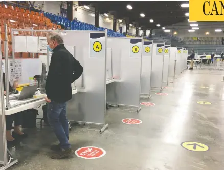  ?? EVANGELINE SADLER ?? There were no lineups to get the Astrozenec­a coronaviru­s vaccine at Bob Birnie Arena in Pointe-claire, outside Montreal, on Tuesday.