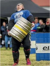  ??  ?? Brydie Anderson, of Palmerston North, gives it her all as she carries 90kg for 60m.