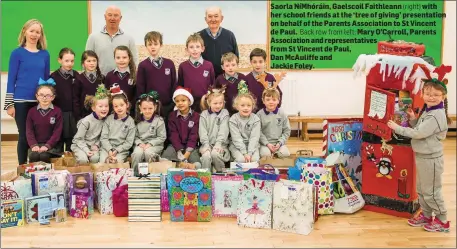  ?? Back row from left: (right) ?? Saorla NíMhóráin, Gaelscoil Faithleann with her school friends at the ‘tree of giving’ presentati­on on behalf of the Parents Associatio­n to St Vincent de Paul. Mary O’Carroll, Parents Associatio­n and representa­tives from St Vincent de Paul,Dan McAuliffe andJackie Foley.