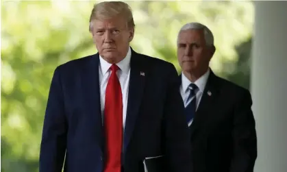  ?? Photograph: Alex Brandon/AP ?? Mike Pence follows Donald Trump out of the Oval Office to speak in the Rose Garden of the White House in April 2020.