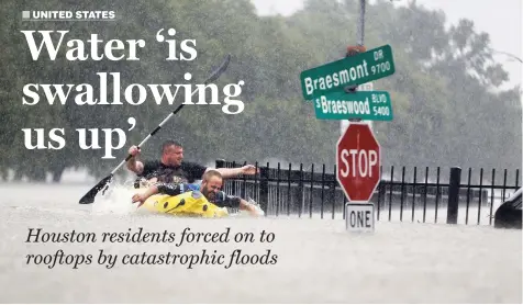  ??  ?? Two kayakers try to beat the current pushing them down an overflowin­g Brays Bayou from Tropical Storm Harvey in Houston, Texas, yesterday.