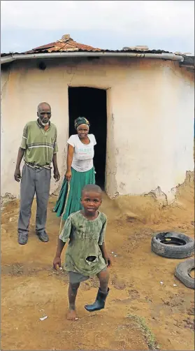  ?? Picture: MICHAEL PINYANA ?? KEEN TO PLAY: Jeffrey Petani, 80, and his wife Nowethu, 72, with grandson Asihlangul­e, 6, in Tsaba village in Chalumna. Asihlangul­e has a disability and they need help to support him