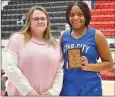  ?? TIMES photograph by Annette Beard ?? Kyona Jackson with the Star City Lady Bulldogs was presented the Talina McDonald Memorial Hustle Award by Tara Kennedy, sister of Talina McDonald. The Lady Bulldogs lost to the Mammoth Springs Lady Bears 40 to 44 in the fourth game on the second day of the tournament.