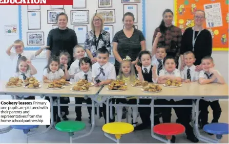  ??  ?? Cookery lesson Primary one pupils are pictured with their parents and representa­tives from the home school partnershi­p