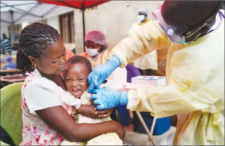  ??  ?? In this July 13, 2019 photo, a child is vaccinated against Ebola in Beni, Congo. Health experts agree the experiment­al Ebola vaccine has saved multitudes
in Congo. But after nearly a year and some 171,000 doses given, the epidemic shows few signs of waning. (AP)