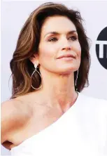  ?? RICH FURY/GETTY IMAGES ?? Cindy Crawford, 53, has posted gym selfies to show that middle-agers can be fit.