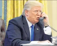  ?? AP PHOTO ?? In this photo taken Jan. 28, 2017, President Donald Trump speaks on the phone with Australian Prime Minister Malcolm Turnbull in the Oval Office of the White House in Washington. Transcript­s of President Donald Trump’s conversati­ons with the leaders of...