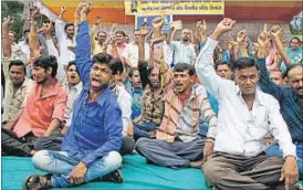  ?? AP PHOTO ?? Dalits shout slogans during a protest against the alleged attack in Una on their community members for skinning a dead cow, in Ahmedabad on Friday.