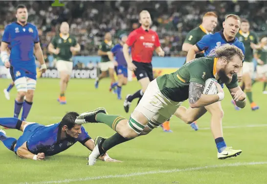  ?? Picture: AFP ?? TRY TIME. Springbok replacemen­t lock RG Snyman goes over to score one of his team’s seven tries in their World Cup match against Italy yesterday in Shizuoka.
