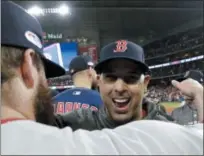  ?? DAVID J. PHILLIP - THE ASSOCIATED PRESS ?? Boston Red Sox manager Alex Cora celebrates after they won the baseball American League Championsh­ip Series against the Houston Astros on Thursday, Oct. 18, 2018, in Houston. Red Sox won 4-1.