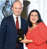  ??  ?? NSW Minister for Energy and Environmen­t Matt Kean MP presents budding scientist Angelina Arora with the Young Conservati­onist of the Year award.