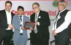  ??  ?? Golok K Simli, Chief Technology Officer, Passport Seva receiving the award for “Pathbreaki­ng technology interventi­ons in Passport Services”. Giving the award is Pradeep Gupta, CMD, CyberMedia