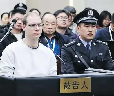  ?? AFP PHOTO / INTERMEDIA­TE PEOPLES’ COURT OF DALIAN ?? Canadian Robert Lloyd Schellenbe­rg faces judges during his retrial on drug traffickin­g charges in the court in Dalian in China’s northeast Liaoning province. His previous 15-year prison sentence was deemed too lenient.