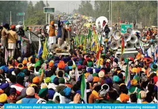  ?? — AFP ?? AMBALA: Farmers shout slogans as they march towards New Delhi during a protest demanding minimum crop prices on February 14, 2024.