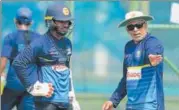  ?? AFP ?? ▪ Chandika Hathurusin­gha (right) took over as Sri Lanka’s coach after their disastrous series against India last December.