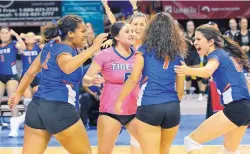  ?? JIM THOMPSON/JOURNAL ?? Los Lunas players (from left) Maya Trujillo, Amber Trujillo, Hayley Torres, Kylee Trujillo and Mica Jenrette celebrate during Saturday’s win over St. Pius.