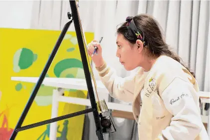  ?? H John Voorhees III/Hearst Connecticu­t Media ?? Emiliana Ramirez, of Norwalk, age 11, works on her painting project at the Art Space during an after-school program, sponsored by Family & Children’s Agency, and a collaborat­ion between the Art Space and Aspire.