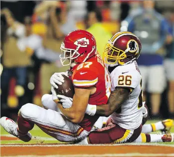  ?? PETER AIKEN/GETTY IMAGES ?? Kansas City Chiefs tight end Travis Kelce hauls in a touchdown reception Monday night during their 29-20 victory over the Washington Redskins at Arrowhead Stadium in Kansas City, Mo.