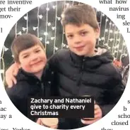  ??  ?? Zachary and Nathaniel give to charity every Christmas