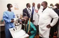  ?? - Picture: Innocent Makawa ?? Acting President Constantin­o Chiwenga talks to Dr BlessingCh­inyerere who was attending to a patient during the official opening of the eye camp and launch of the national eye health strategy at Parirenyat­wa Group of Hospitals in Harare yesterday.